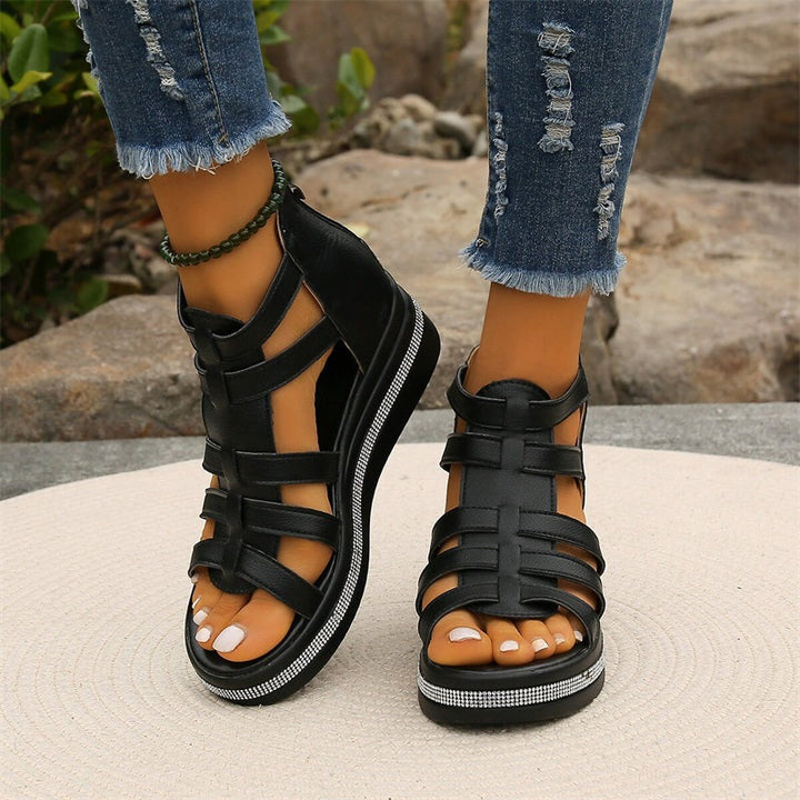 Beige women's wedge sandals with glittering rhinestone accents, offering elegant style and comfort for summer outings.