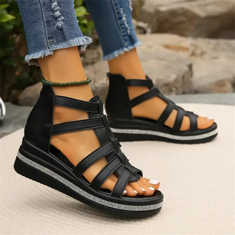 Beige women's wedge sandals with glittering rhinestone accents, offering elegant style and comfort for summer outings.