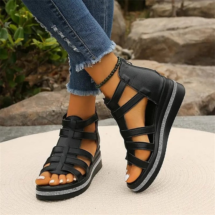 Beige women's wedge sandals with glittering rhinestone accents, offering elegant style and comfort for summer outings.