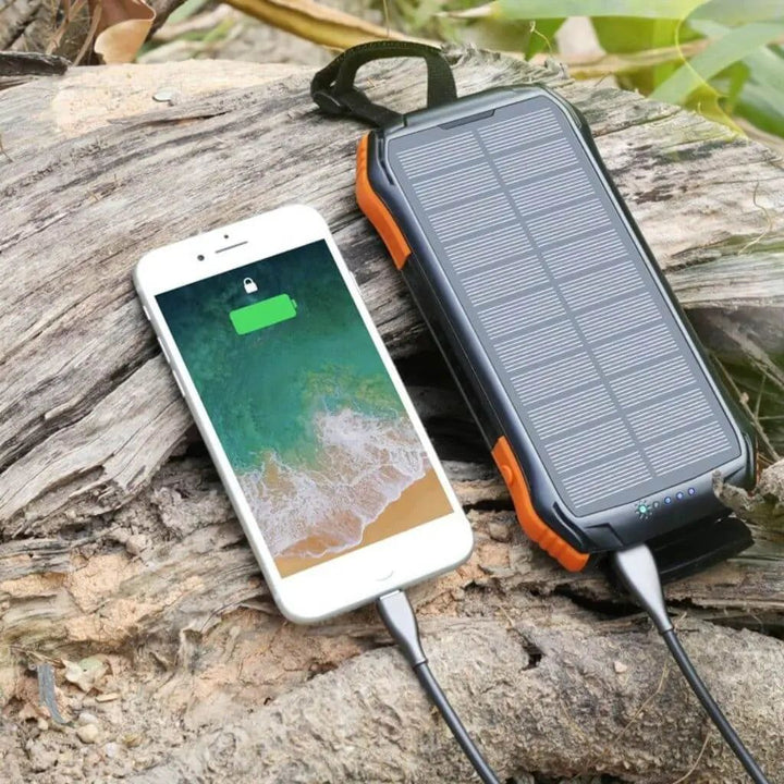 "Black and orange portable solar power bank for outdoor use, showcasing sleek design and multiple charging ports."