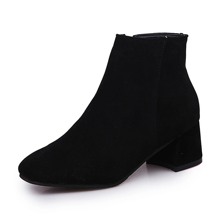 "Black suede women's ankle boots with side zip and low block heel, showcasing a stylish and comfortable design."
