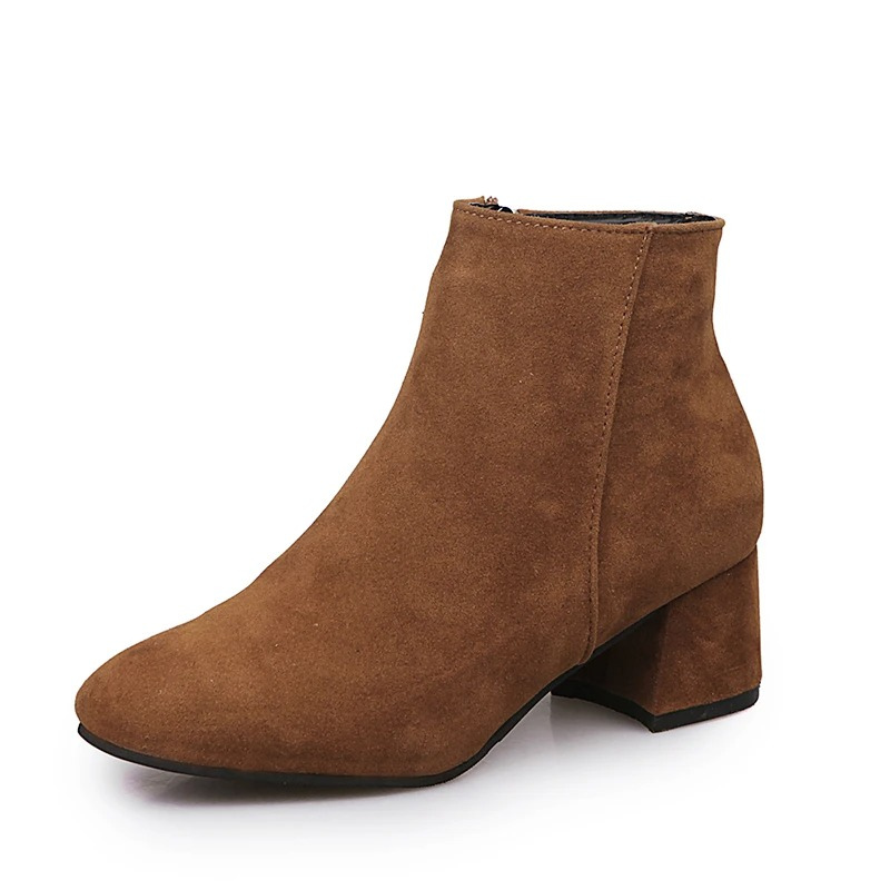 "Black suede women's ankle boots with side zip and low block heel, showcasing a stylish and comfortable design."