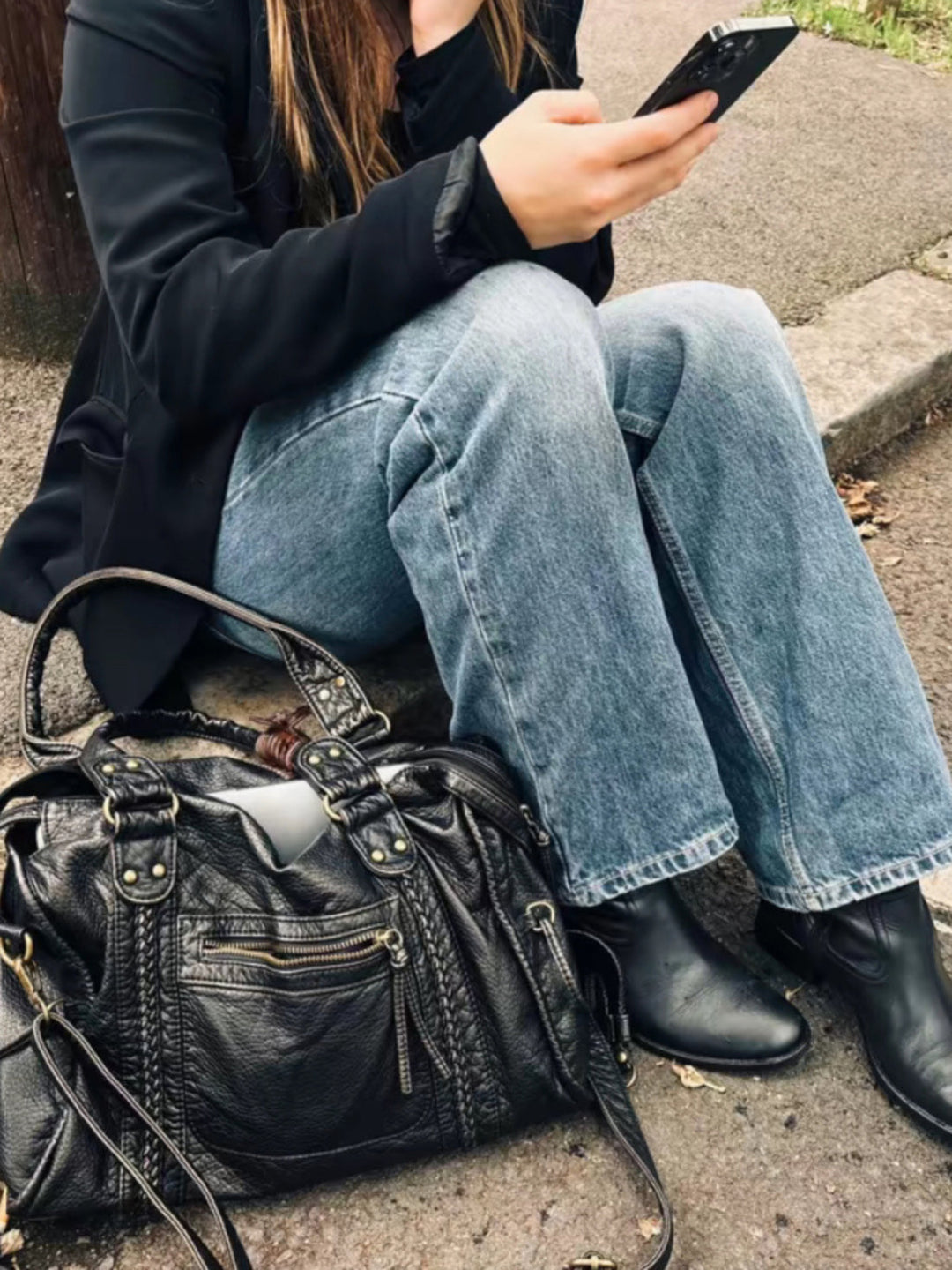 "Black vegan leather shoulder bag for women with elegant design, adjustable strap, and secure closures, perfect for daily use