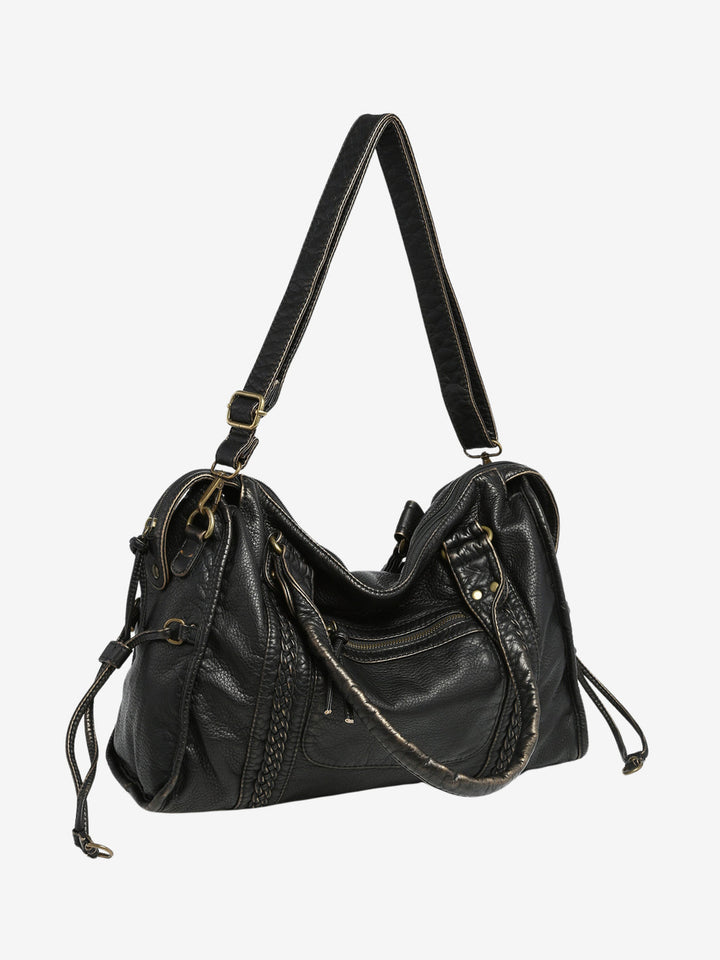 "Black vegan leather shoulder bag for women with elegant design, adjustable strap, and secure closures, perfect for daily use