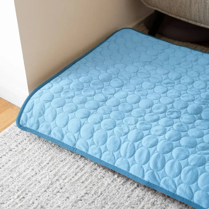 "Blue dog cooling mat, foldable and portable, offers instant cooling, waterproof, and safe for indoor and outdoor use."