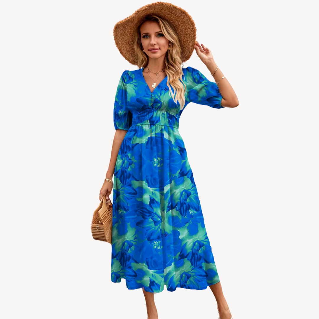 Blue floral print V-neck midi dress with tie waist, short puff sleeves, and flowing silhouette, ideal for elegant styles.
