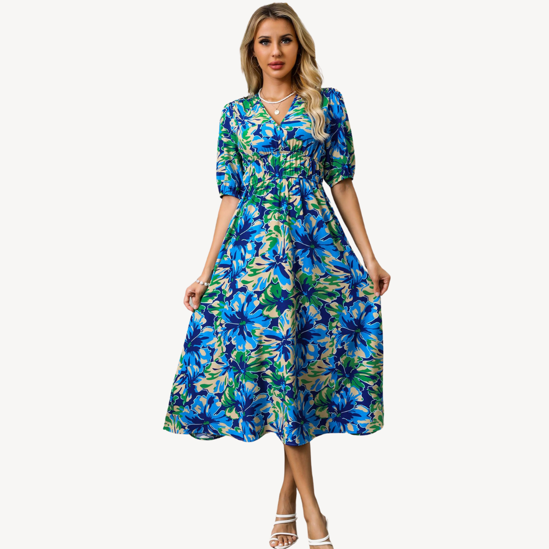 Blue floral print V-neck midi dress with tie waist, short puff sleeves, and flowing silhouette, ideal for elegant styles.
