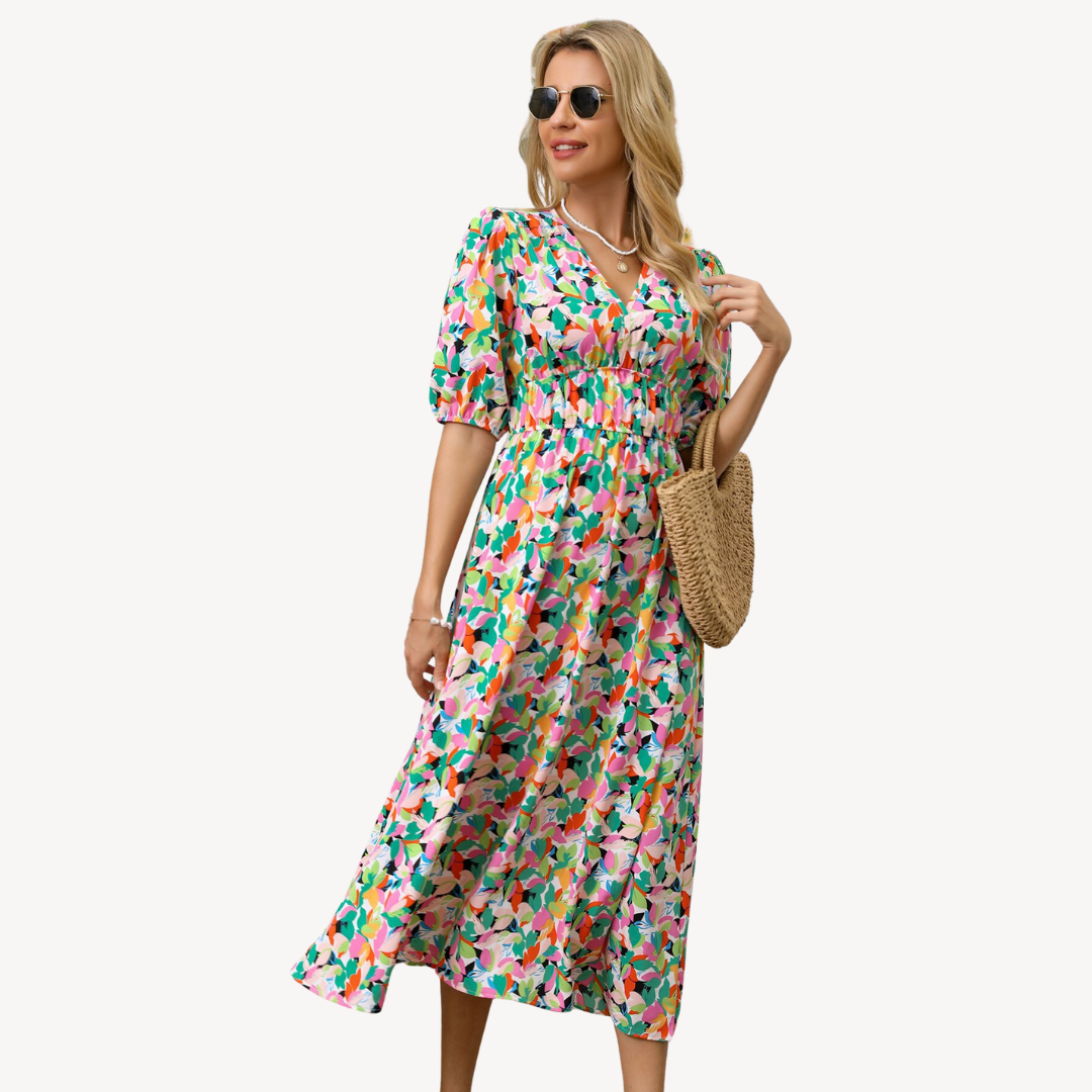 Blue floral print V-neck midi dress with tie waist, short puff sleeves, and flowing silhouette, ideal for elegant styles.