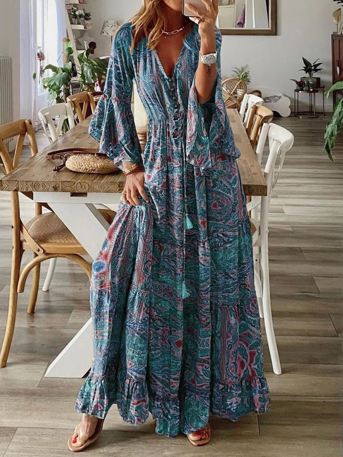 Bohemian paisley maxi dress with flared sleeves, vibrant print, flowy design, captures chic style for women's summer wear.