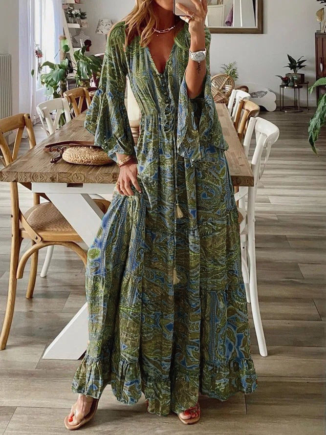 Bohemian paisley maxi dress with flared sleeves, vibrant print, flowy design, captures chic style for women's summer wear.