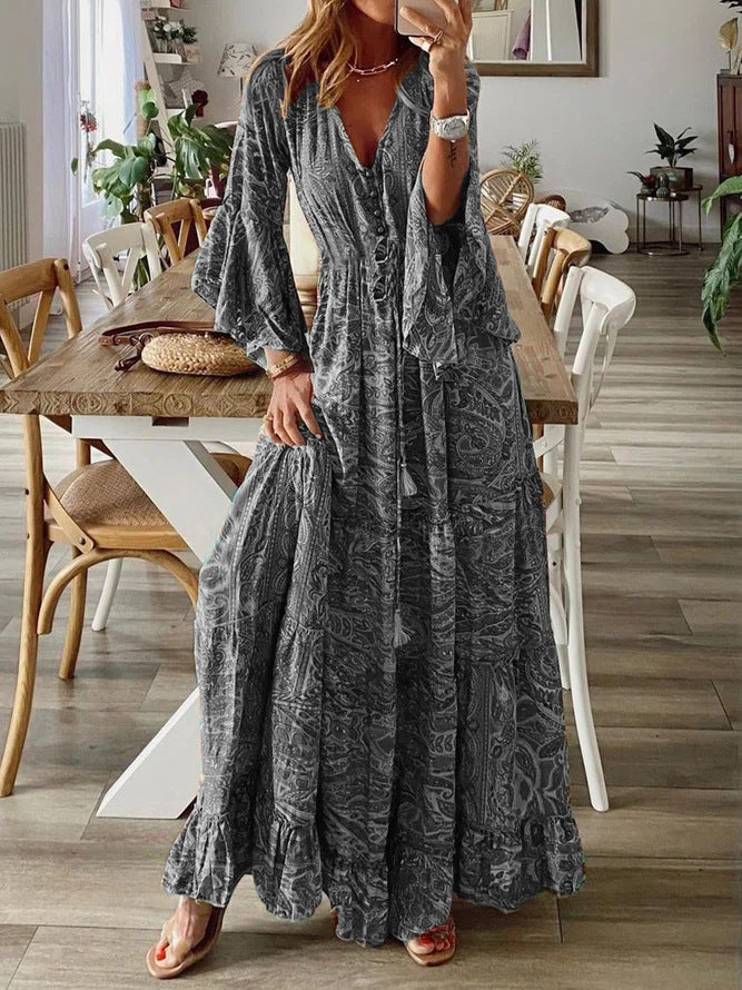 Bohemian paisley maxi dress with flared sleeves, vibrant print, flowy design, captures chic style for women's summer wear.