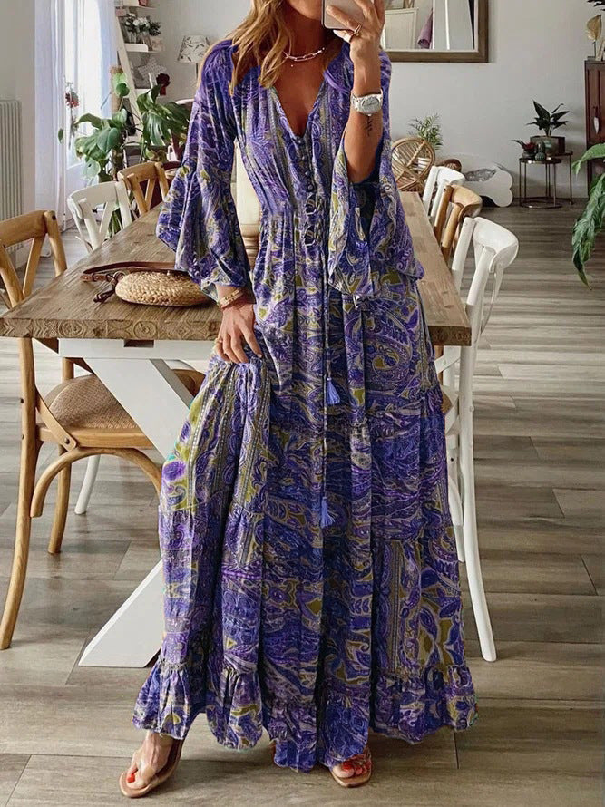 Bohemian paisley maxi dress with flared sleeves, vibrant print, flowy design, captures chic style for women's summer wear.