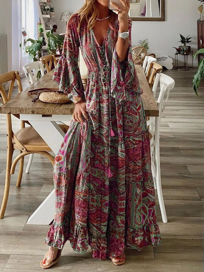 Bohemian paisley maxi dress with flared sleeves, vibrant print, flowy design, captures chic style for women's summer wear.