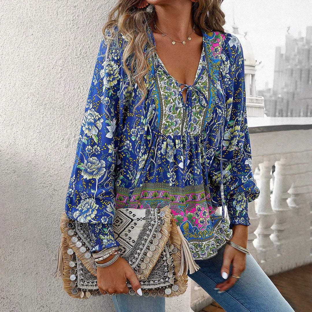 Bohemian V-Neck women's blouse with long sleeves, tie detail, vibrant print, perfect for casual outfits.