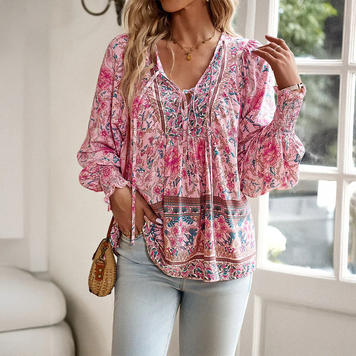 Bohemian V-Neck women's blouse with long sleeves, tie detail, vibrant print, perfect for casual outfits.