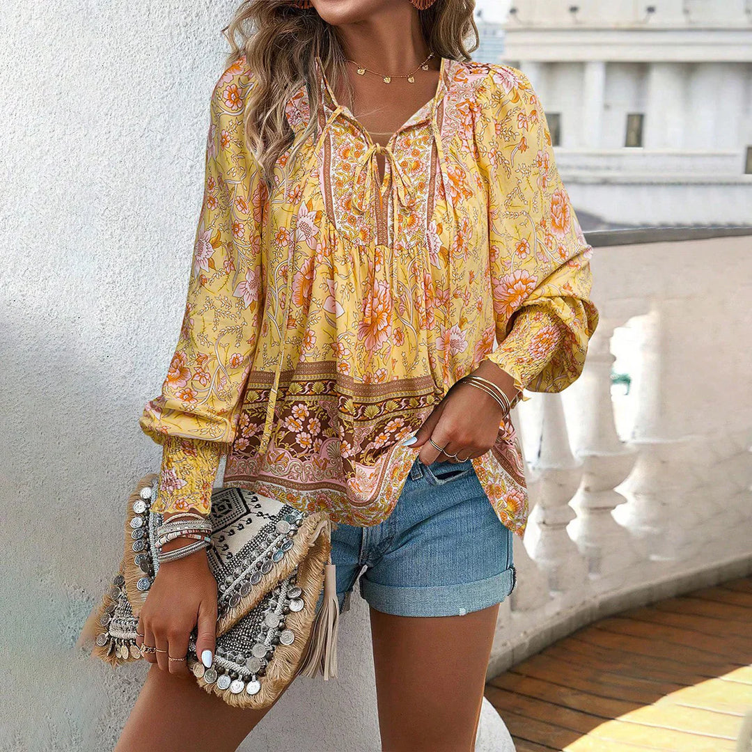Bohemian V-Neck women's blouse with long sleeves, tie detail, vibrant print, perfect for casual outfits.