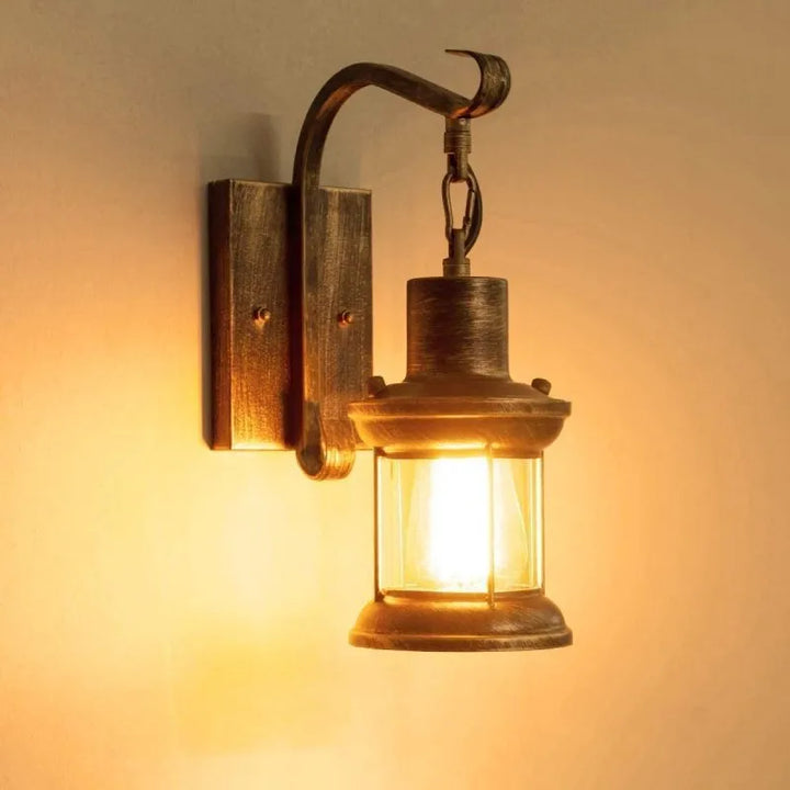 Bronze vintage industrial wall sconce lamp with oil-bronze finish and glass shade, perfect for living room lighting.