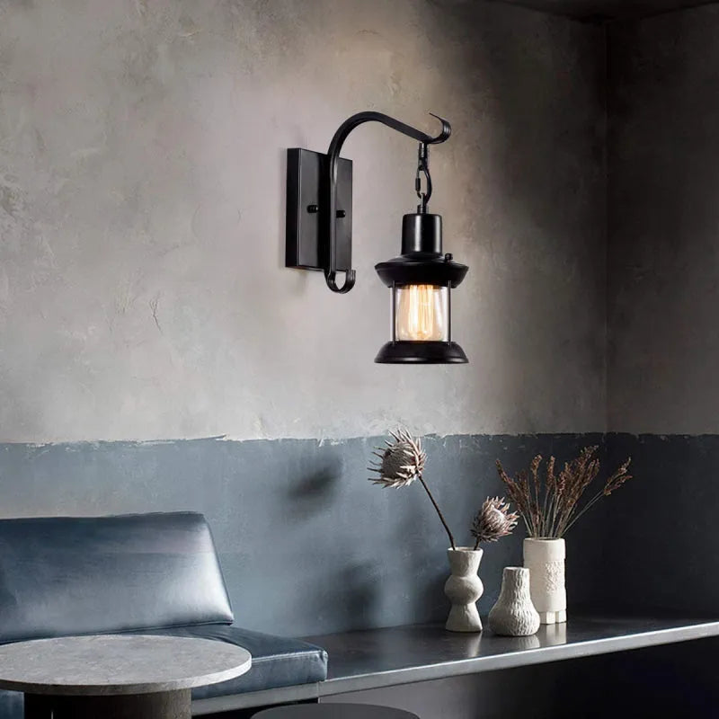 Bronze vintage industrial wall sconce lamp with oil-bronze finish and glass shade, perfect for living room lighting.