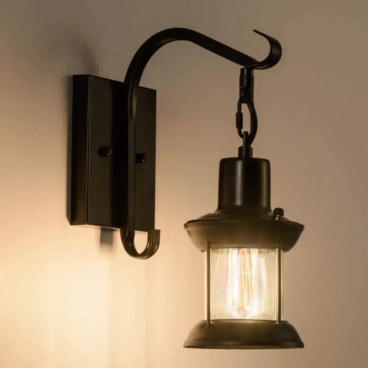 Bronze vintage industrial wall sconce lamp with oil-bronze finish and glass shade, perfect for living room lighting.