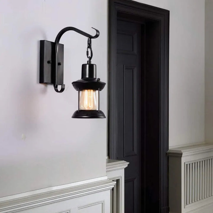 Bronze vintage industrial wall sconce lamp with oil-bronze finish and glass shade, perfect for living room lighting.