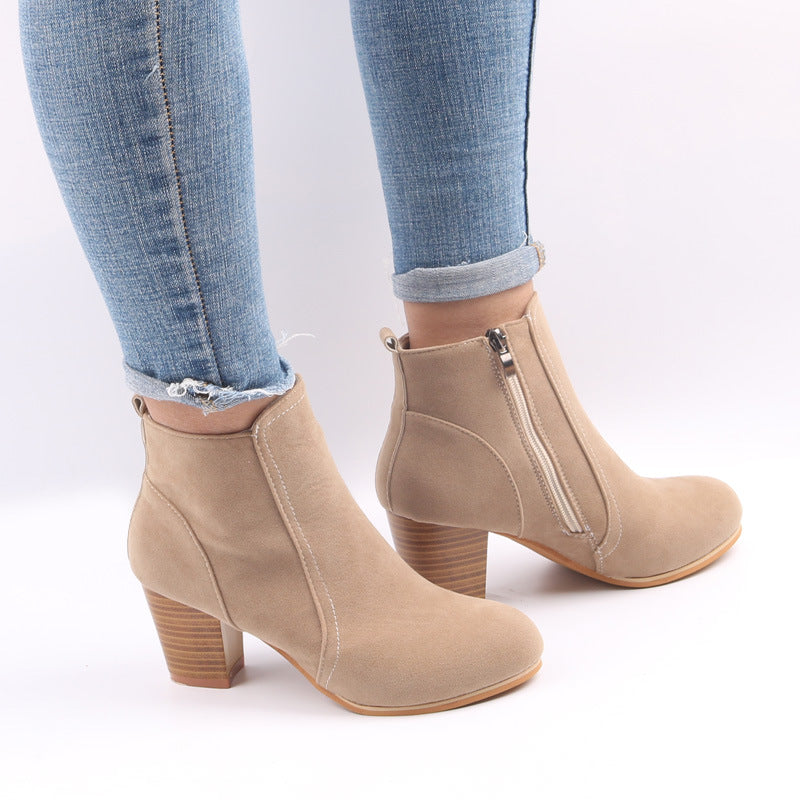 Burgundy women's suede ankle boots with chunky heel and side zip, showcasing stylish comfort and modern elegance.