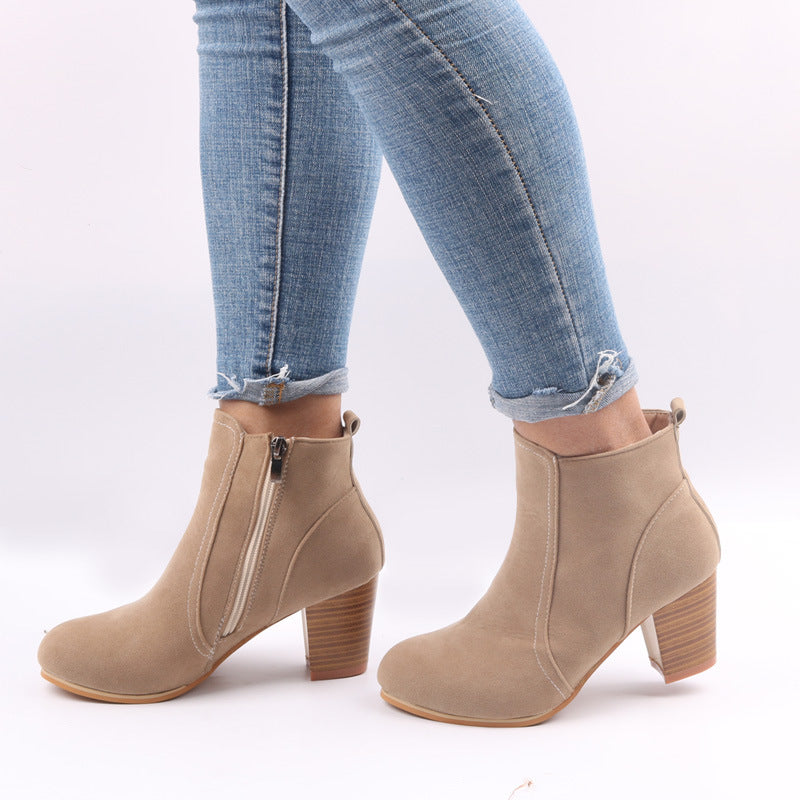 Burgundy women's suede ankle boots with chunky heel and side zip, showcasing stylish comfort and modern elegance.