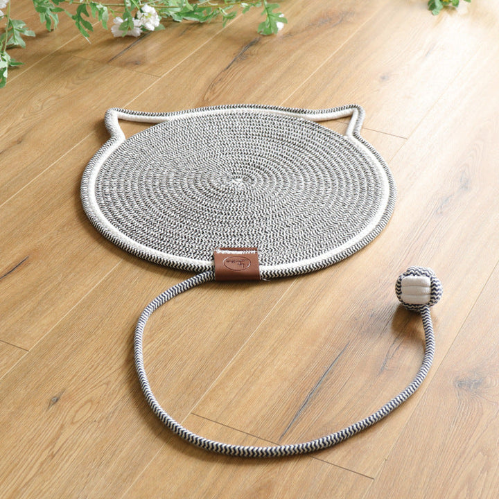 "Cat lounging on stylish, durable cat scratching rug; elegant, textured mat for optimal claw care and furniture protection."