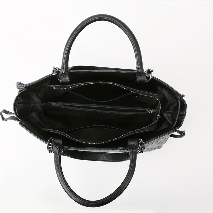 Chic black shoulder bag for women, sleek and spacious; ideal for office and casual use, complements all outfits.