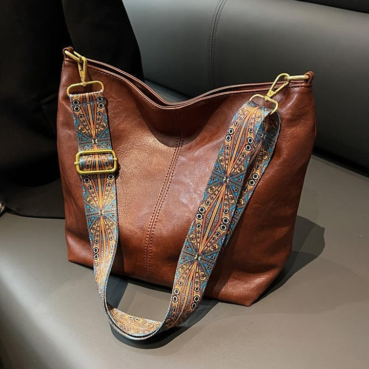 "Chic medium faux leather shoulder bag with embellished adjustable strap in black, caramel, green, or khaki for women."