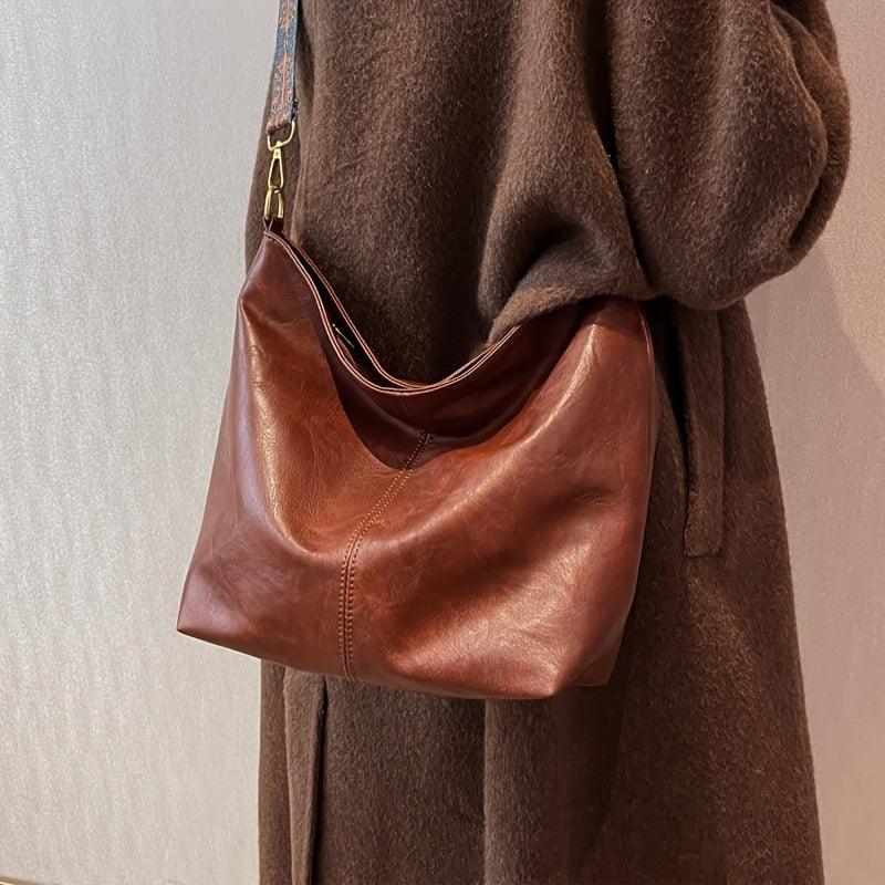 "Chic medium faux leather shoulder bag with embellished adjustable strap in black, caramel, green, or khaki for women."