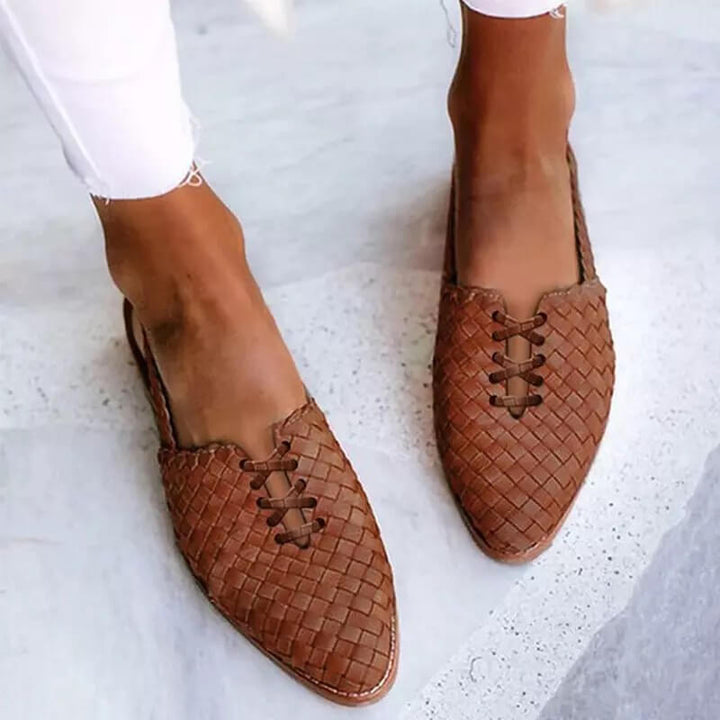 Chic women's closed-toe sandals with slip-on design, elegant detailing, side view, ideal for casual summer wear.