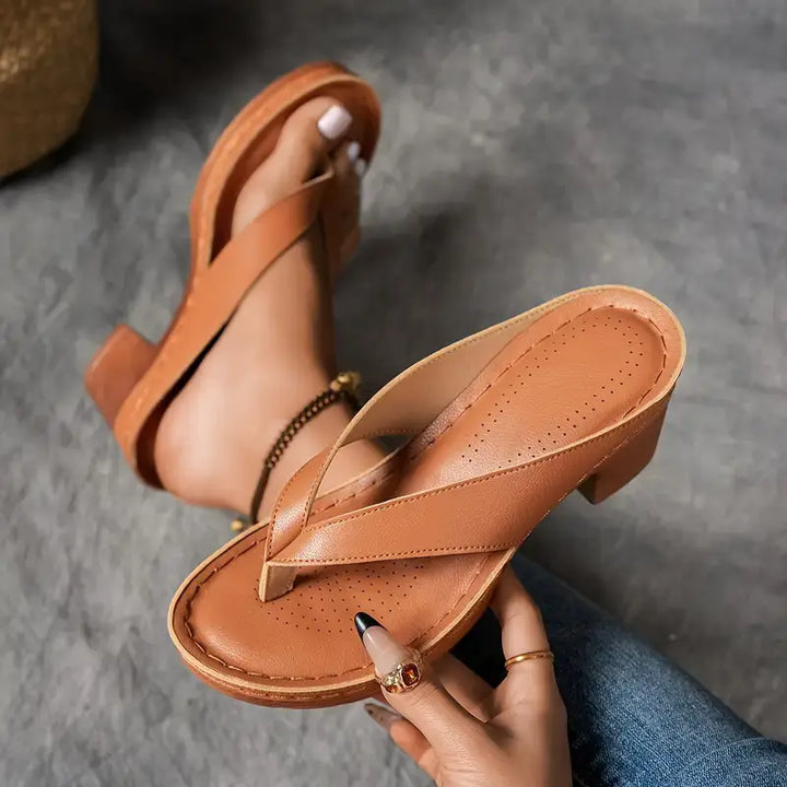 "Chic women's flip-flop sandals with platform heels, wide straps, open-toe design, in black, brown, gold, or white."