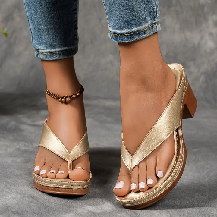 "Chic women's flip-flop sandals with platform heels, wide straps, open-toe design, in black, brown, gold, or white."