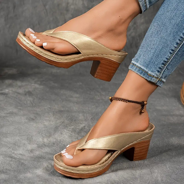 "Chic women's flip-flop sandals with platform heels, wide straps, open-toe design, in black, brown, gold, or white."