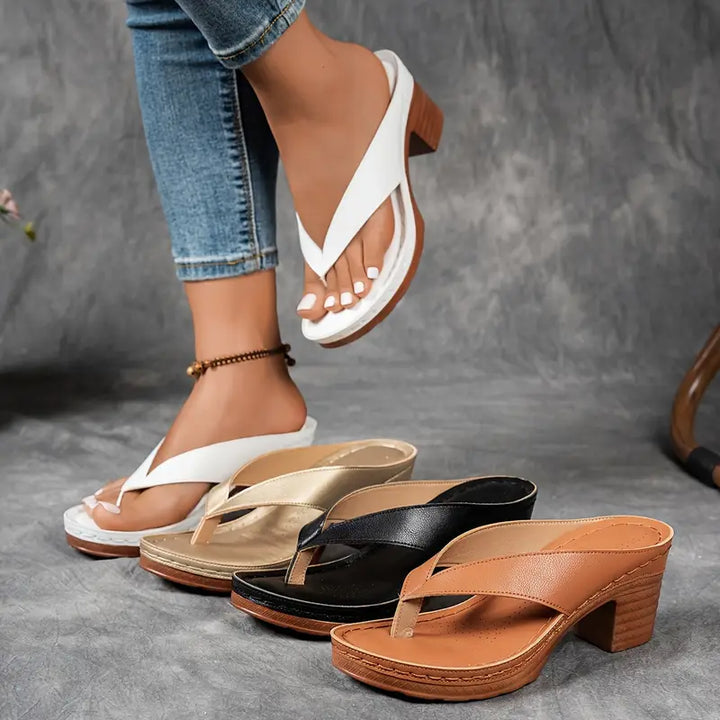 "Chic women's flip-flop sandals with platform heels, wide straps, open-toe design, in black, brown, gold, or white."