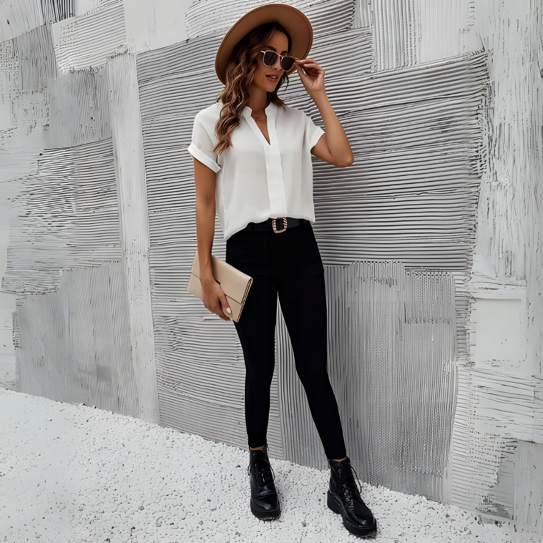 Chic women's V-neck blouse in soft polyester-viscose, tailored fit, versatile for elegant day or night looks.
