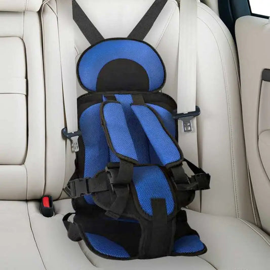 Child car cushion seat in red for ages 0-12, showcasing soft, compact design and secure restraints for safe, comfortable trav