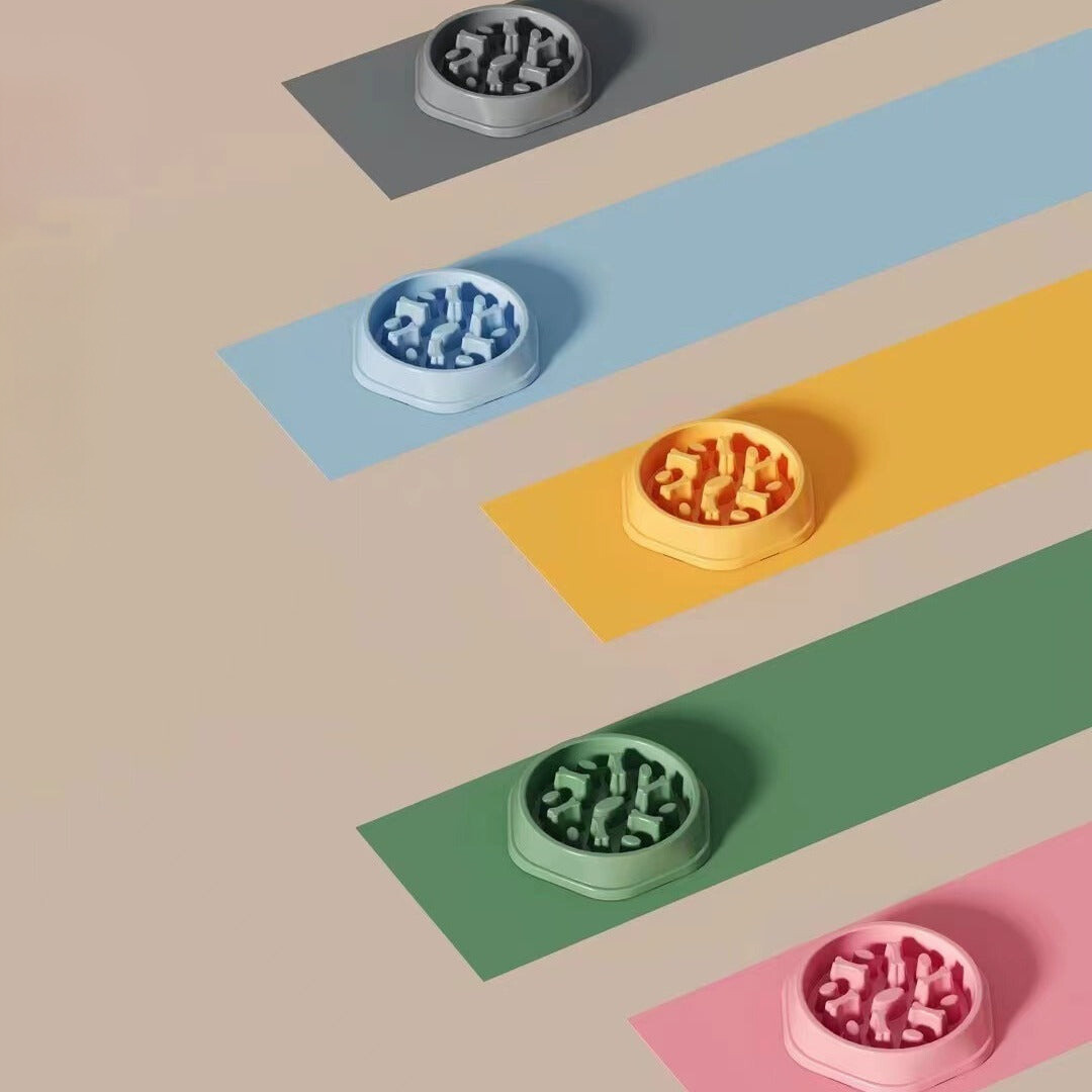 "Colorful slow eating feeding bowl for dogs with bone-shaped obstacles, promoting healthy digestion and reducing choking risk