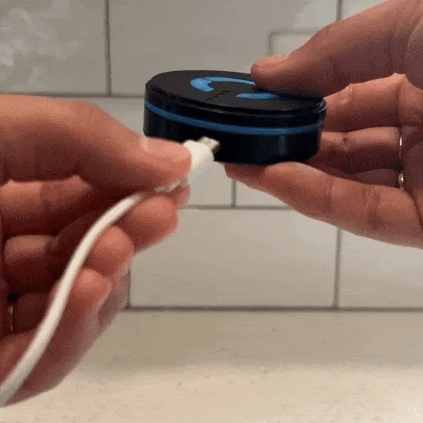 Compact device offering sciatica relief and cognitive therapy, featuring ergonomic design and integrated EMS massage patches.
