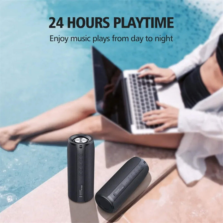 "Compact waterproof Bluetooth wireless speaker; sleek black design, portable, ideal for indoor and outdoor use."