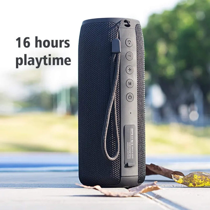 "Compact waterproof Bluetooth wireless speaker; sleek black design, portable, ideal for indoor and outdoor use."