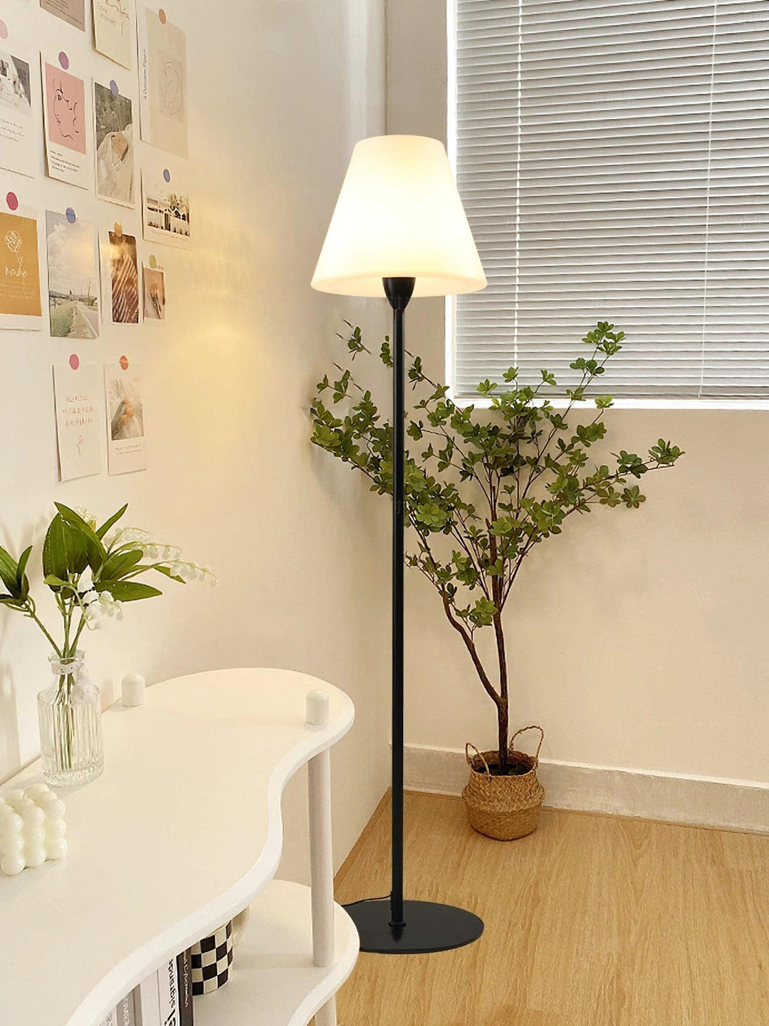 "Contemporary metal and acrylic floor-standing lamp with sleek lines, modern flair, perfect for home decor lighting."