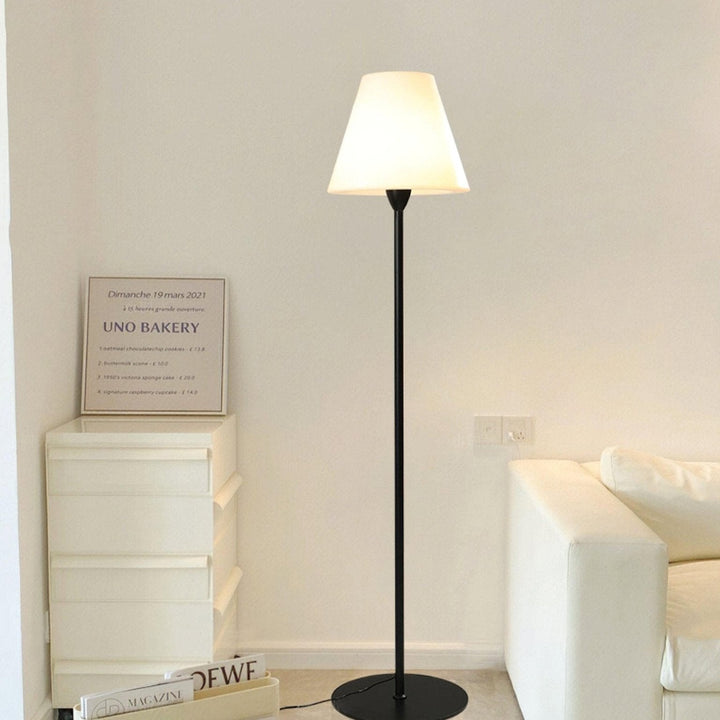 "Contemporary metal and acrylic floor-standing lamp with sleek lines, modern flair, perfect for home decor lighting."