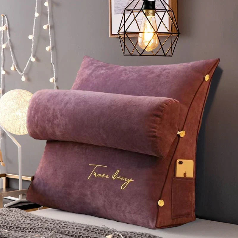 Contoured wedge pillow with ergonomic design, offering back support and a soft fabric cover for comfort and pressure relief.
