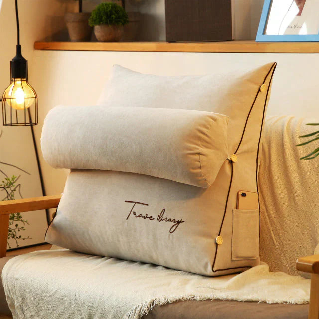 Contoured wedge pillow with ergonomic design, offering back support and a soft fabric cover for comfort and pressure relief.