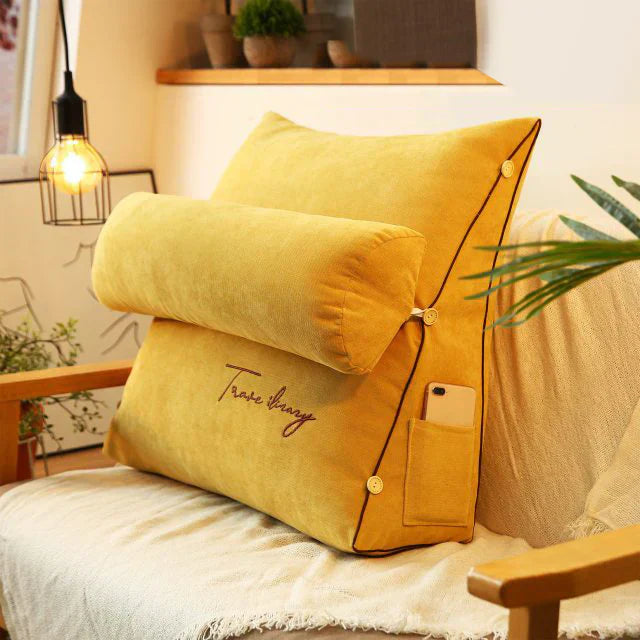 Contoured wedge pillow with ergonomic design, offering back support and a soft fabric cover for comfort and pressure relief.