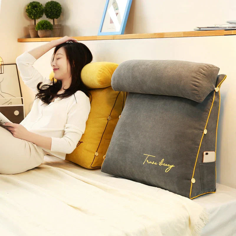 Contoured wedge pillow with ergonomic design, offering back support and a soft fabric cover for comfort and pressure relief.