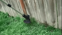 Cordless lightweight grass trimmer with ergonomic handle, high-power battery, and protective blade guard for efficient trimmi