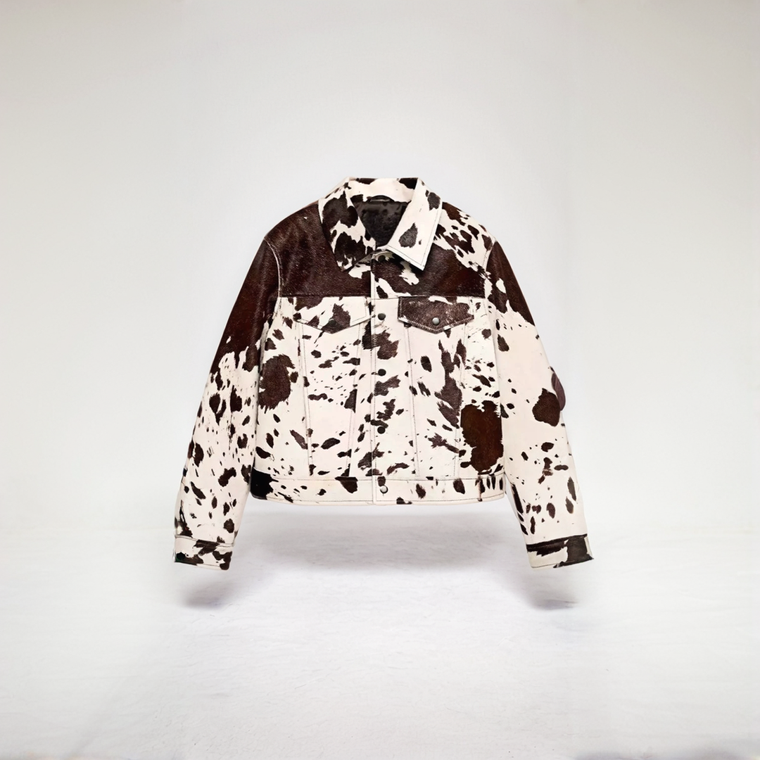 Cow print structured jacket, front view, single-breasted design, black and white pattern, women's fashion statement piece.
