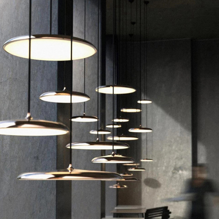 "Disc-shaped Scandinavian pendant light with LED, metal & acrylic materials, in elegant minimalist design for modern décor."